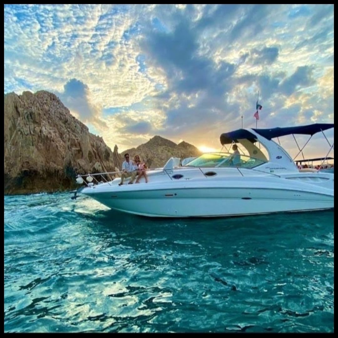 yacht in dramatic sunset, brilliant HDR water